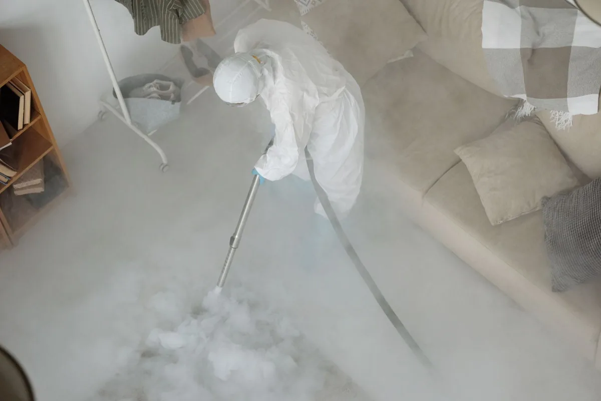 Biohazard cleanup technician in protective equipment, Buckhall, VA
